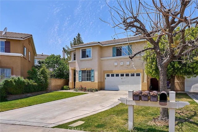 traditional home with fence, a garage, stucco siding, a front yard, and concrete driveway