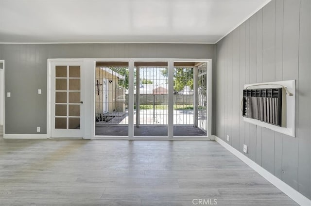 9451 Canterbury Ave, Arleta, CA 91331 - entryway with healthy amount of natural light, wood finished floors, baseboards, and wooden walls