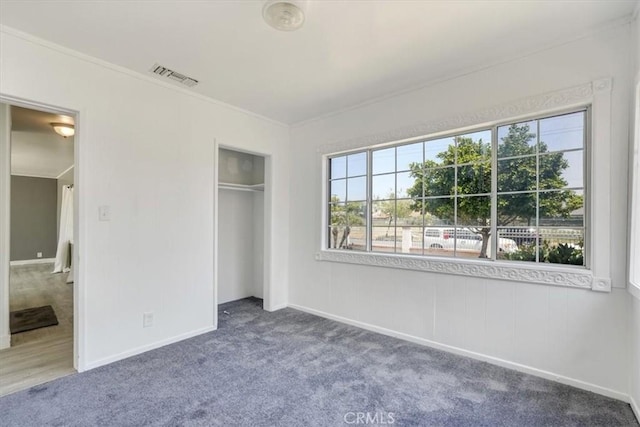 9451 Canterbury Ave, Arleta, CA 91331 - unfurnished bedroom featuring carpet, ornamental molding, baseboards, and a closet