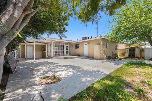 9451 Canterbury Ave, Arleta, CA 91331 - back of house with stucco siding and a patio area