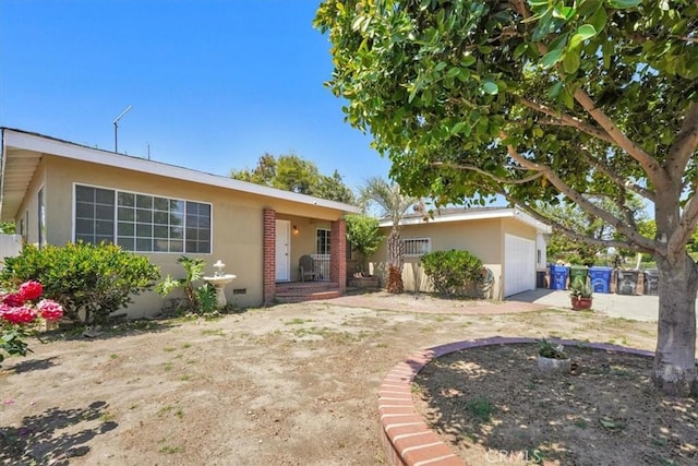 9451 Canterbury Ave, Arleta, CA 91331 - ranch-style home featuring an attached garage and stucco siding