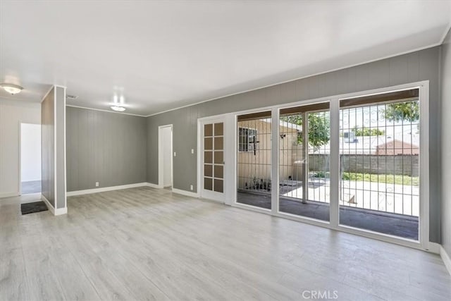 9451 Canterbury Ave, Arleta, CA 91331 - unfurnished living room with ornamental molding, wood finished floors, and baseboards