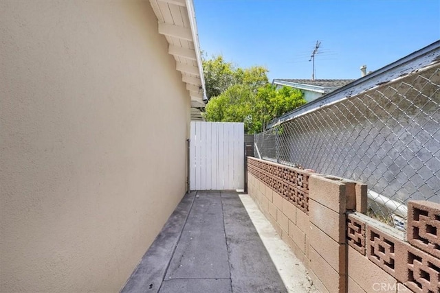 9451 Canterbury Ave, Arleta, CA 91331 - view of side of property featuring stucco siding and fence