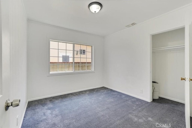 9451 Canterbury Ave, Arleta, CA 91331 - unfurnished bedroom featuring dark colored carpet, ornamental molding, and baseboards