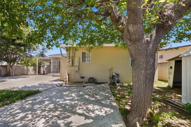 9451 Canterbury Ave, Arleta, CA 91331 - back of property with a patio, fence, and stucco siding