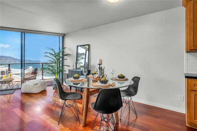 531 Esplanade Unit 714, Redondo Beach, CA 90277 - dining area with wood finished floors, floor to ceiling windows, and baseboards