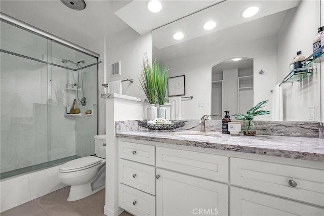 531 Esplanade Unit 714, Redondo Beach, CA 90277 - bathroom featuring toilet, a stall shower, tile patterned floors, vanity, and recessed lighting