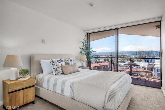531 Esplanade Unit 714, Redondo Beach, CA 90277 - bedroom with access to exterior, light carpet, floor to ceiling windows, and baseboards
