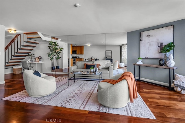 531 Esplanade Unit 714, Redondo Beach, CA 90277 - living area with stairway, wood finished floors, and baseboards