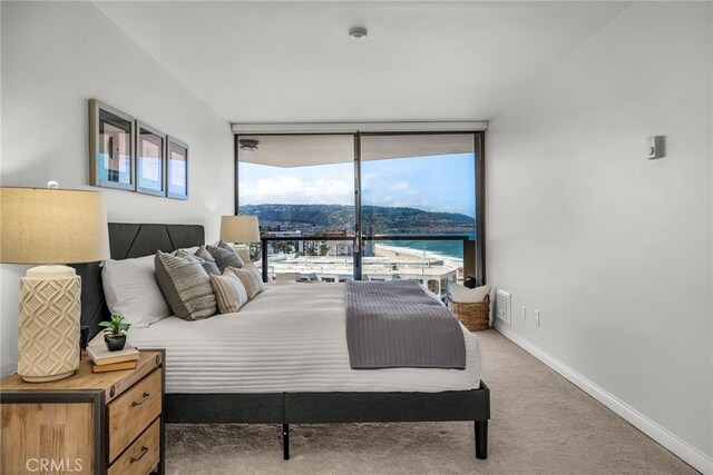 531 Esplanade Unit 714, Redondo Beach, CA 90277 - bedroom featuring a wall of windows and carpet