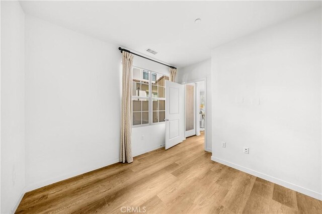 65 Tallowood, Irvine, CA 92620 - unfurnished room with light wood-style flooring and baseboards