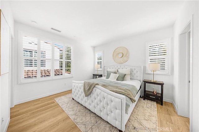 65 Tallowood, Irvine, CA 92620 - bedroom featuring light wood-type flooring and baseboards