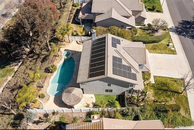 aerial view of property and surrounding area with a pool area