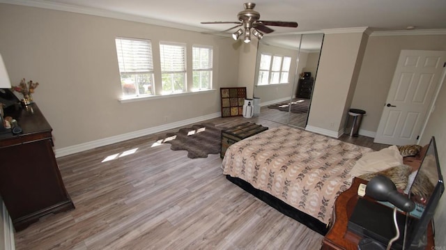 42944 Calle Reva, Temecula, CA 92592 - bedroom featuring wood finished floors, ornamental molding, a closet, baseboards, and a ceiling fan