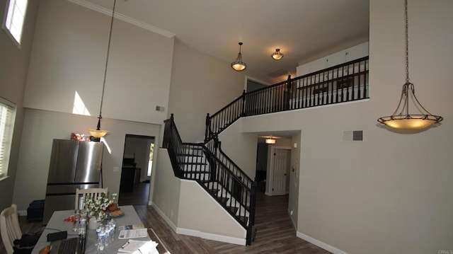 42944 Calle Reva, Temecula, CA 92592 - dining space with a high ceiling, wood finished floors, baseboards, and stairs