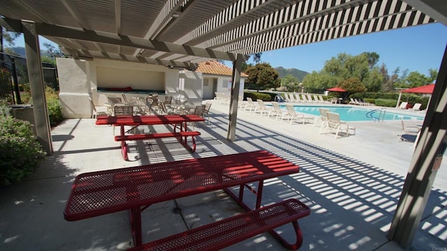 42944 Calle Reva, Temecula, CA 92592 - view of patio / terrace featuring a pergola, a community pool, and a mountain view