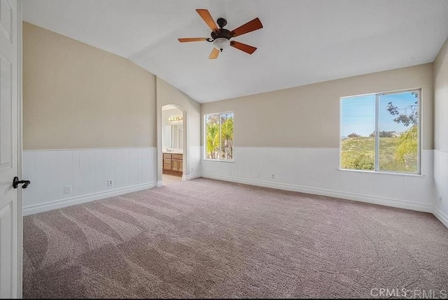 42944 Calle Reva, Temecula, CA 92592 - carpeted empty room featuring a ceiling fan, lofted ceiling, a wainscoted wall, and arched walkways