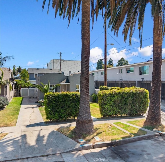 844W 105th St, Los Angeles, CA 90044 - view of front of property featuring fence and stucco siding
