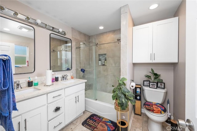 844W 105th St, Los Angeles, CA 90044 - bathroom with toilet, double vanity, tile patterned flooring, enclosed tub / shower combo, and recessed lighting