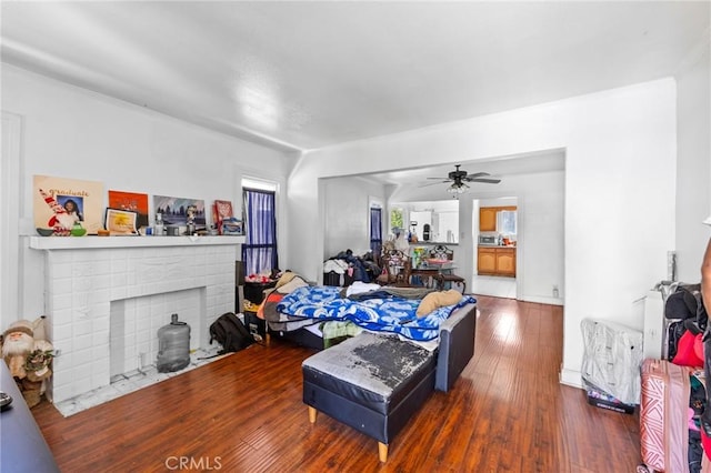 844W 105th St, Los Angeles, CA 90044 - living area featuring hardwood / wood-style floors, a ceiling fan, and a brick fireplace