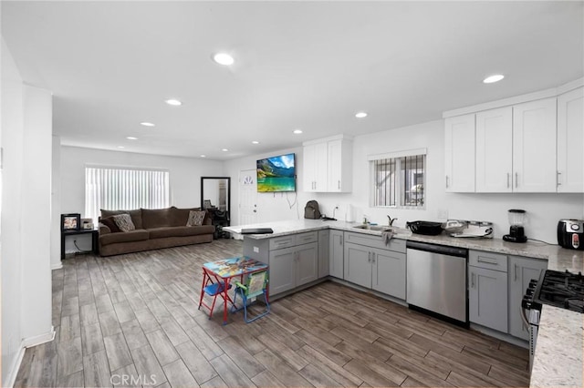 844W 105th St, Los Angeles, CA 90044 - kitchen with stainless steel appliances, gray cabinets, a peninsula, wood finished floors, and recessed lighting