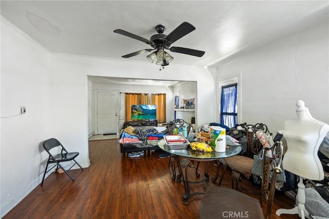 844W 105th St, Los Angeles, CA 90044 - dining area featuring wood finished floors, a ceiling fan, and baseboards