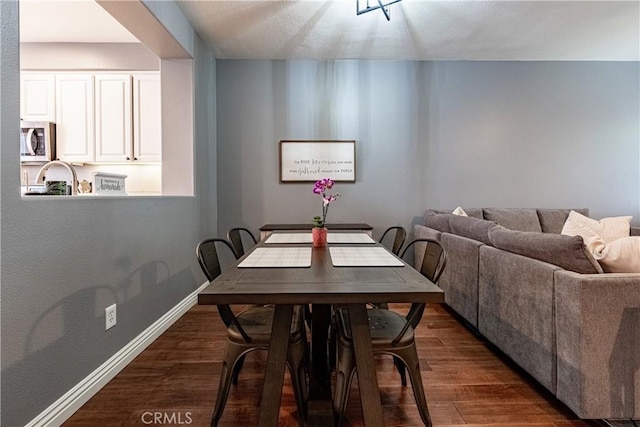7 Burlingame Ln, Aliso Viejo, CA 92656 - dining room featuring dark wood-style flooring and baseboards