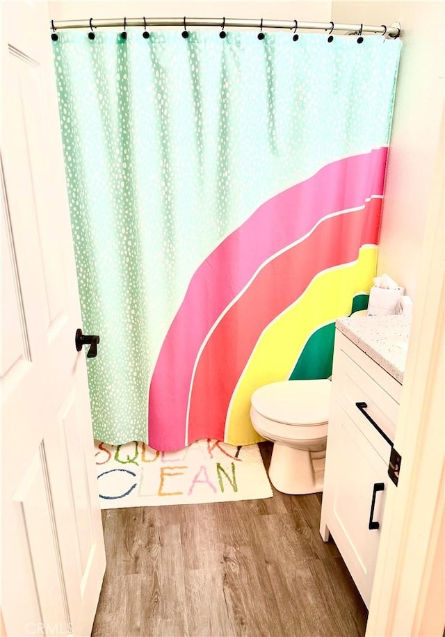 7 Burlingame Ln, Aliso Viejo, CA 92656 - bathroom with wood finished floors, toilet, vanity, and curtained shower