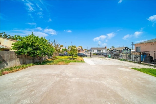 exterior space with fence and a residential view