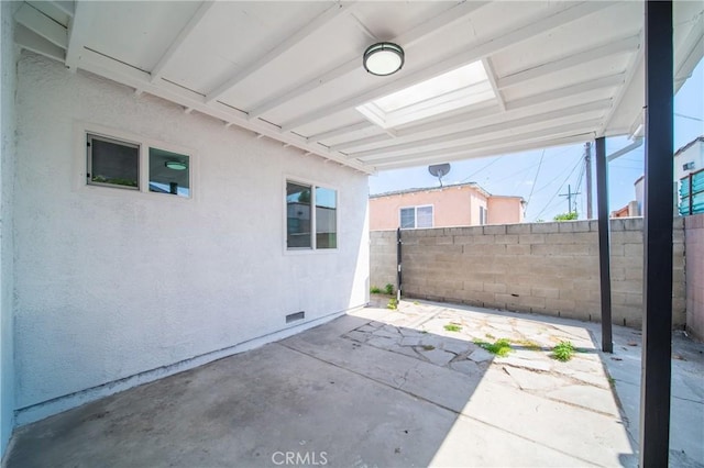 view of patio featuring fence
