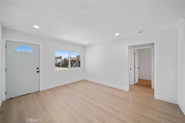entryway with recessed lighting, baseboards, and light wood-style flooring