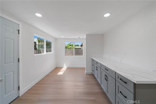 bar with recessed lighting, baseboards, and light wood-style floors