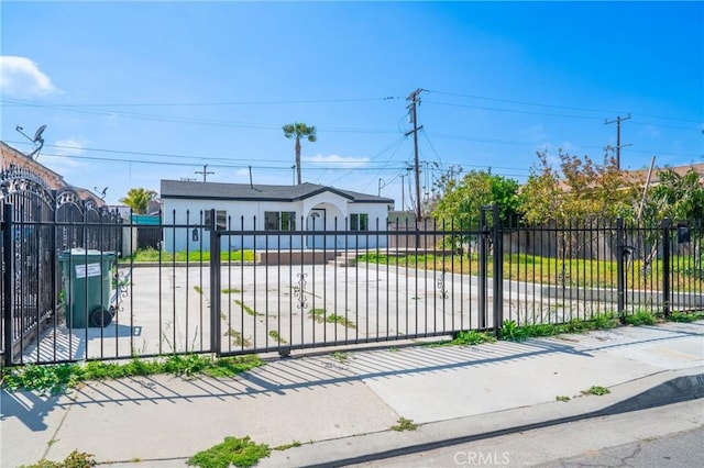 view of gate featuring a fenced front yard