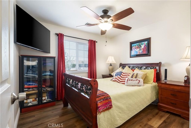 bedroom featuring wood finished floors and ceiling fan
