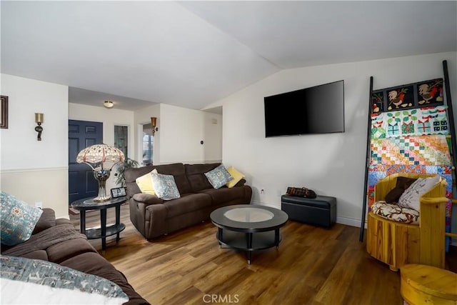 living area with wood finished floors, lofted ceiling, and baseboards