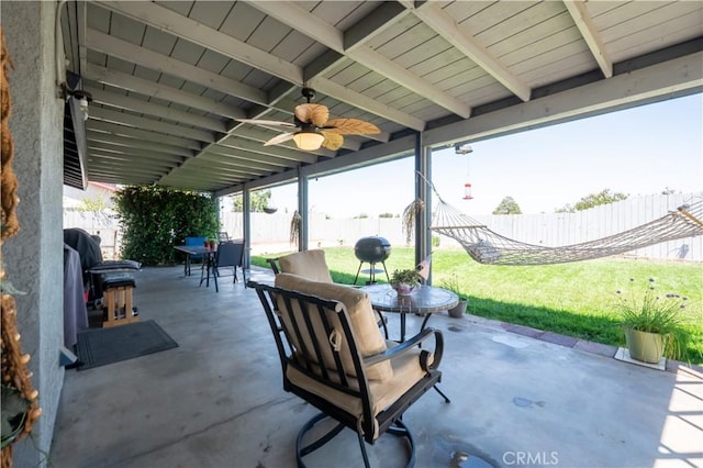 view of patio featuring outdoor dining space and ceiling fan