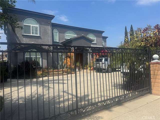 11331 Chapman Ave, Garden Grove, CA 92840 - view of front of property with a gate and stucco siding