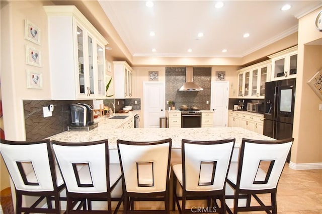 11331 Chapman Ave, Garden Grove, CA 92840 - kitchen featuring stainless steel appliances, a sink, a peninsula, wall chimney range hood, and decorative backsplash