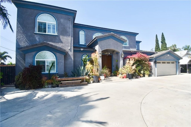11331 Chapman Ave, Garden Grove, CA 92840 - view of front of house featuring stucco siding, concrete driveway, and a garage
