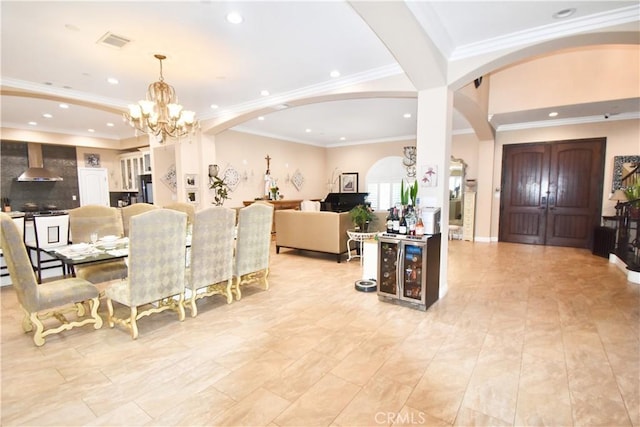 11331 Chapman Ave, Garden Grove, CA 92840 - dining space with arched walkways, a chandelier, recessed lighting, and crown molding