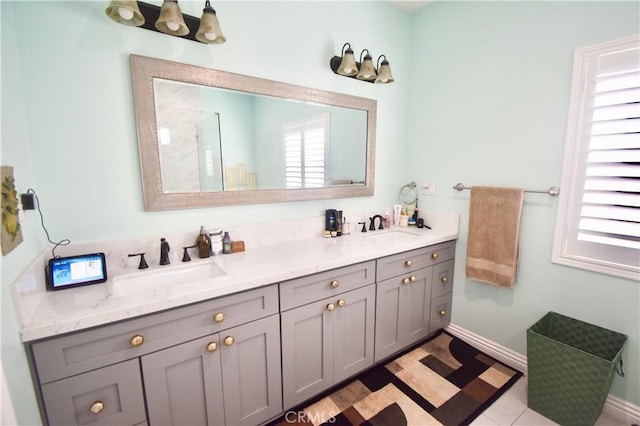 11331 Chapman Ave, Garden Grove, CA 92840 - bathroom featuring double vanity, baseboards, and a shower