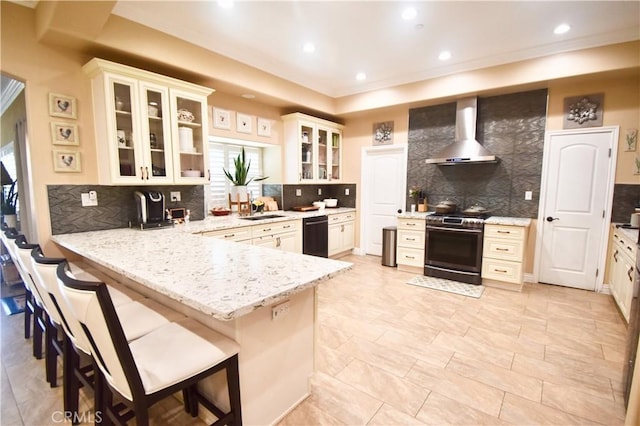11331 Chapman Ave, Garden Grove, CA 92840 - kitchen with wall chimney exhaust hood, stainless steel range oven, a sink, a peninsula, and tasteful backsplash