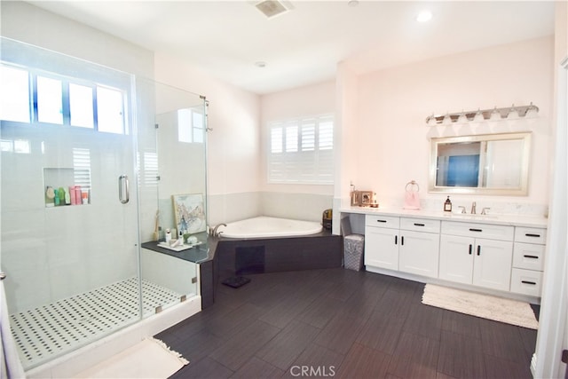 11331 Chapman Ave, Garden Grove, CA 92840 - full bath with a garden tub, vanity, a stall shower, wood finished floors, and recessed lighting