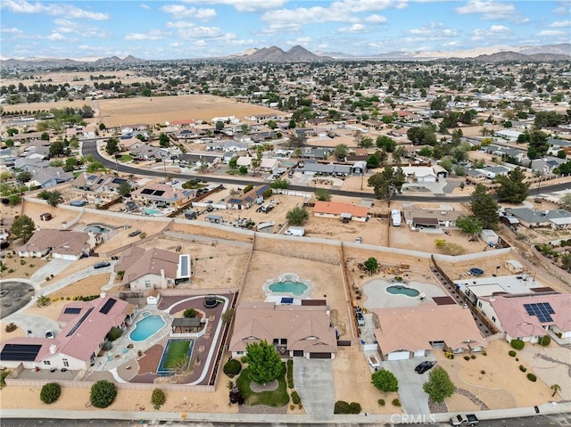 birds eye view of property featuring a mountain view and a residential view