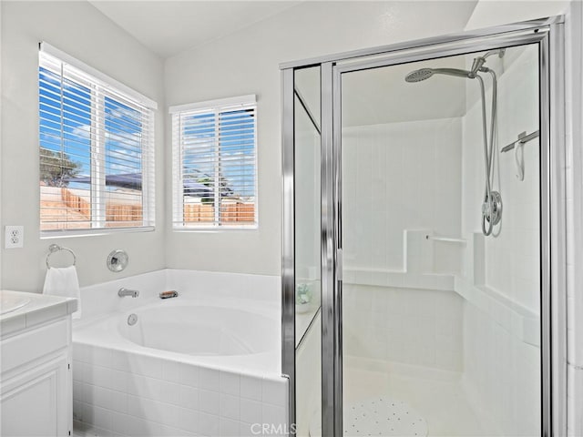 full bathroom with a shower stall, a garden tub, and vanity