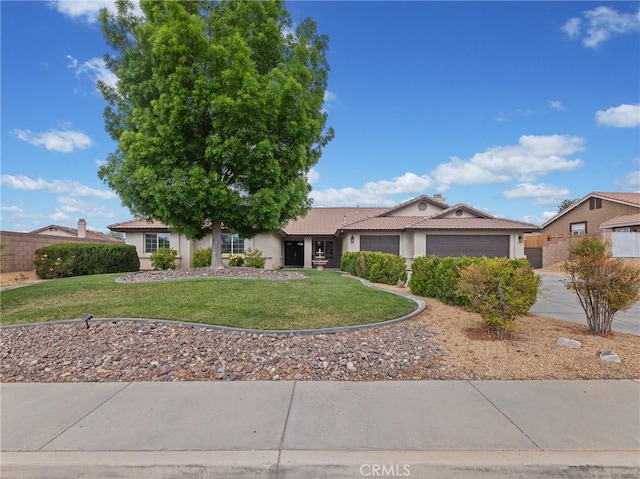ranch-style home featuring a tile roof, a garage, a front lawn, concrete driveway, and stucco siding