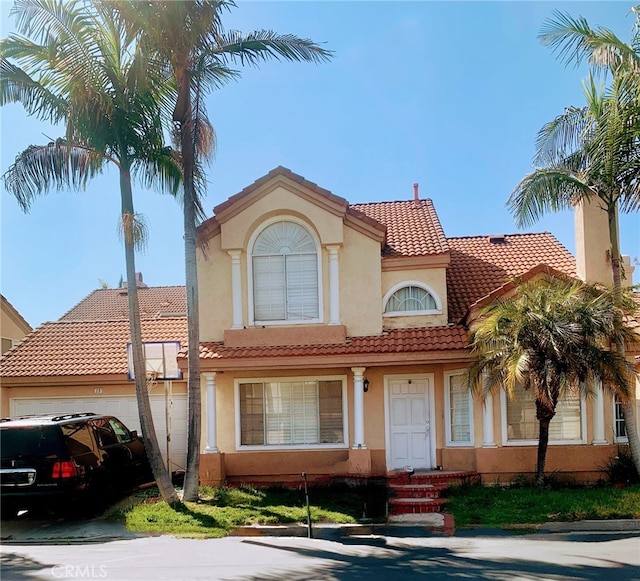 13 Santa Monica St, Aliso Viejo, CA 92656 - mediterranean / spanish-style home with stucco siding, a tile roof, and a garage