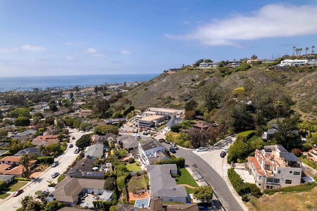 drone / aerial view featuring a water view and a residential view