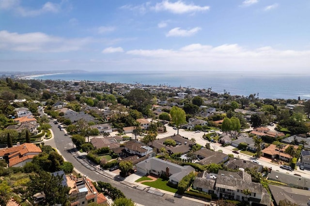 birds eye view of property featuring a water view and a residential view