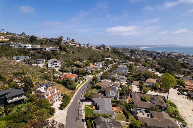 drone / aerial view featuring a residential view and a water view